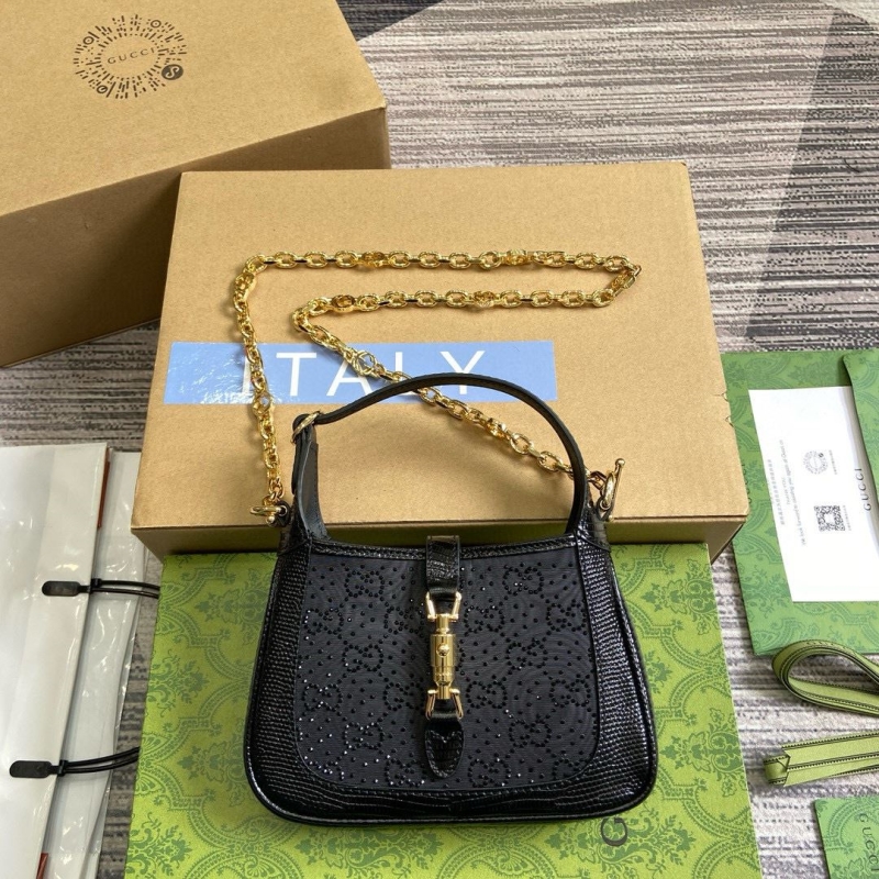 G*u*i top handle bags